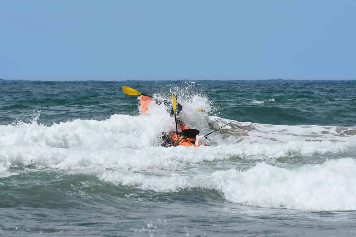 Photo of Kayak Crashing Through Surf
